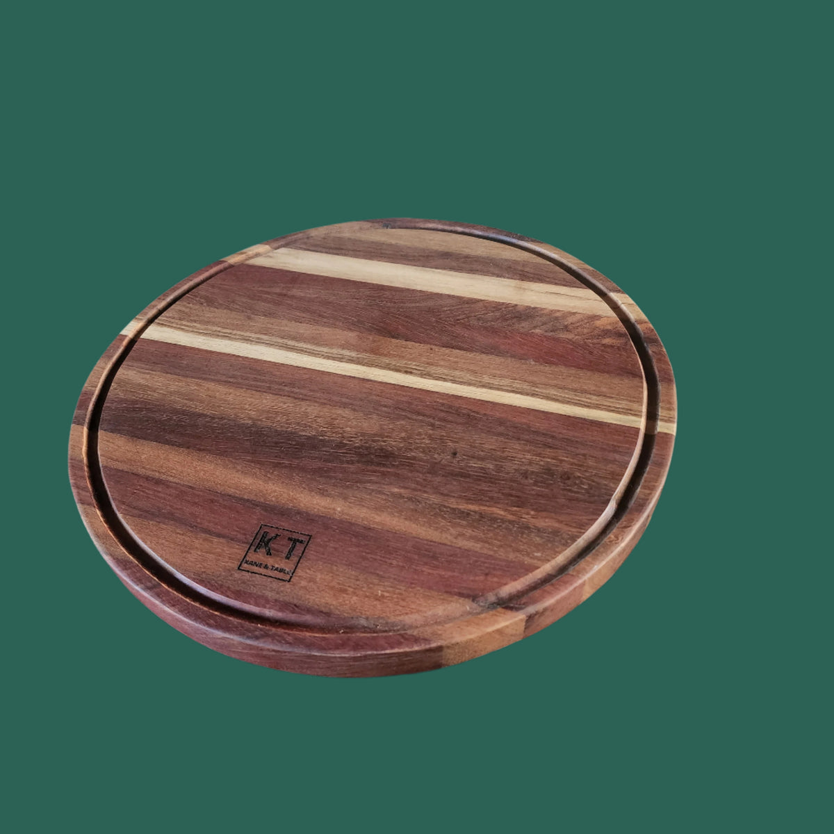 Round handcrafted wooden chopping block by Kane and Table