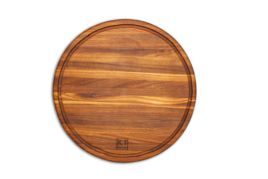 Round handcrafted wooden chopping block by Kane and Table
