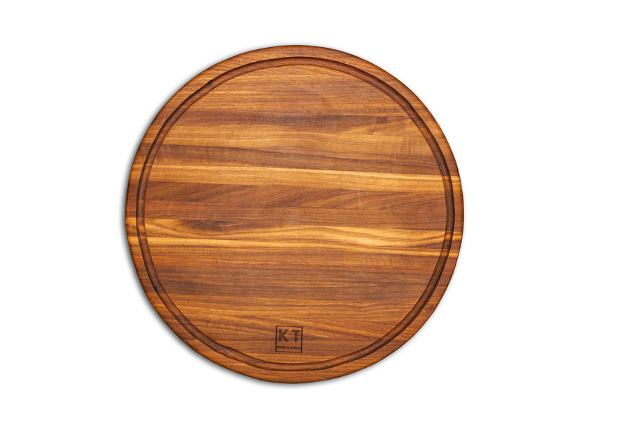 Round handcrafted wooden chopping block by Kane and Table