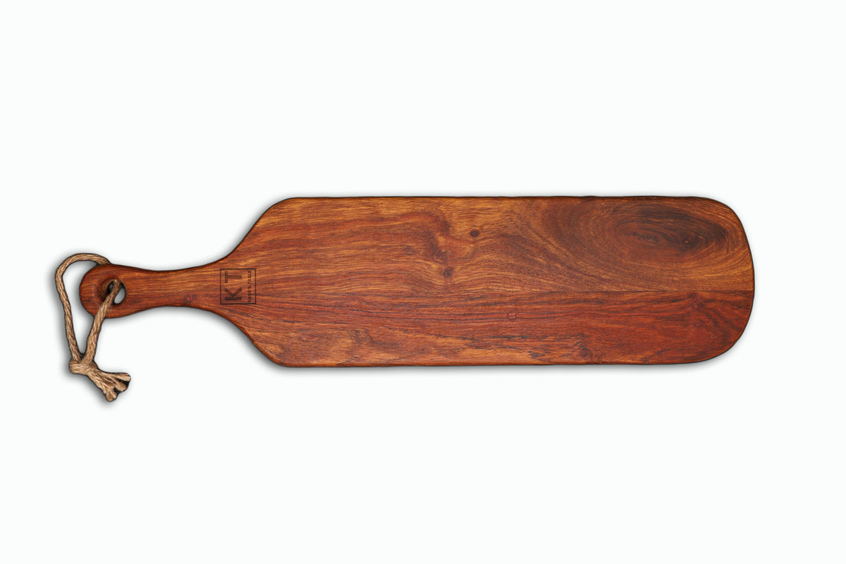 Medium handcrafted wooden paddle serving board with rope handle